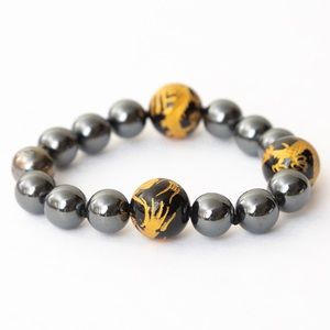 Hematite bracelet with onyx gold leaf interspersed dragon beads magnetic closure